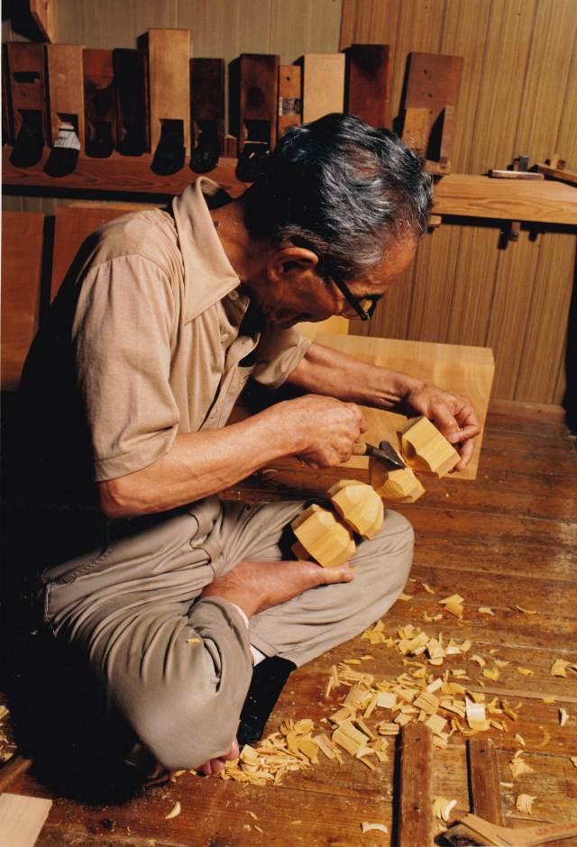 Carving a foot of a Go board